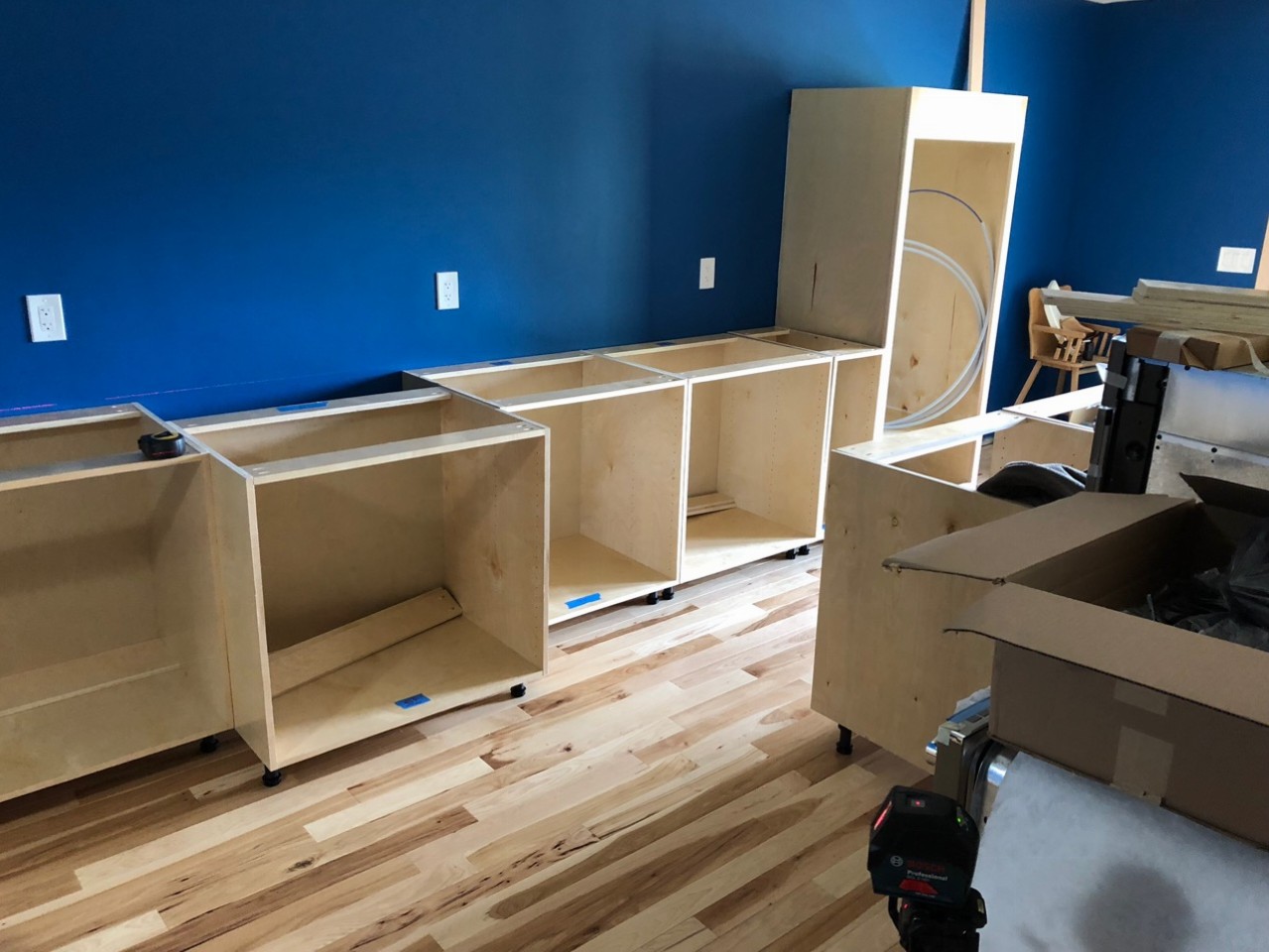 Long wall of cabinets with Wall Oven setup