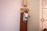 Top view showing a kerf cut in the block that holds the dial gauge and the bolt used to tighten the gauge in place.