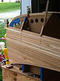 A few more done. Strips were 3/4 wide by 1/4 thick with bead on the bottom and cove on the top. All cedar was bought at the local big chain hardware store in 6,8,10 and 12 foot lengths. I think I still have splinters from going though all the wood to find boards with the fewest knots.
