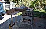Infeed side with one support off of the saw. If you look on the bottom of the sled, you can see the UHMW "glides" that travel through the aluminum tracks.

It slides easily and with the beam clamped to the sled there is minimal chance of binding on the blade.