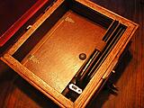 Inside of charging station.
it holds my mini iPad and two kindles in the front... under the the little flip door is the charging strip,
which has 5 charging ports.