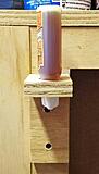 Straight on view of the simple L bracket Gorilla Glue bottle holder this angle doesn't show it well but the bottle is below the top edge of the dust collector Hood