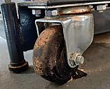 Exhibit A: broken wheel of a castor under a unisaw
