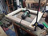 Side panel glued up, router set up waiting for glue to dry to cut the rabbet.