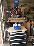 Drill press on tool box.